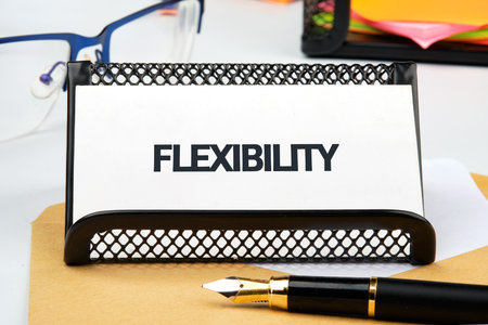 Business flexibility concept. Copy space. Flexibility symbol. Concept word Flexibility in a business card on a standの写真素材