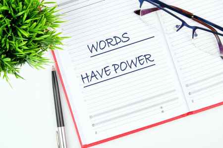 WORDS HAVE POWER TEXT written in the business notebookの写真素材
