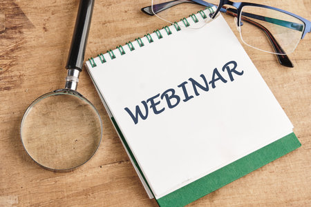 WEBINAR words written in a notebook on a background, top viewの写真素材