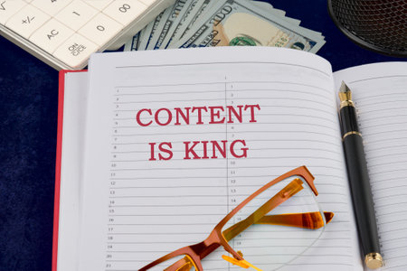 Business and Content is king concept. Copy space. CONTENT IS KING writing in a notebook on a dark backgroundの写真素材
