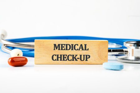 MEDICAL CHECK-UP words written on a wooden block. Front viewの写真素材