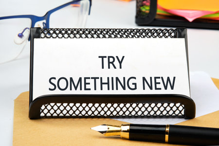 Business, time for something new concept. TRY SOMETHING NEW in a business card on a stand.の写真素材