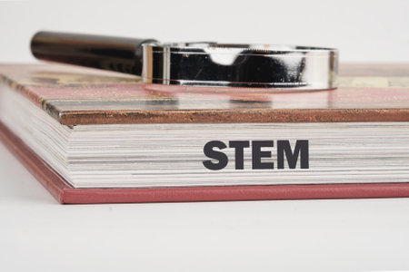 STEM word on the end of the book in close-up.の写真素材