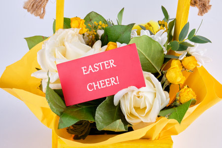 The concept of holidays. The phrase EASTER CHEER on a red business card against a background of...