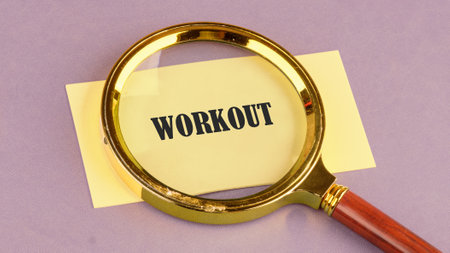 Fitness strong power. WORKOUT word through a magnifying glass on a yellow sticker, it symbolizes the...