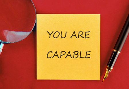 Business capable or incapable concept. Copy space. Motivational words YOU ARE CAPABLE on a yellow...