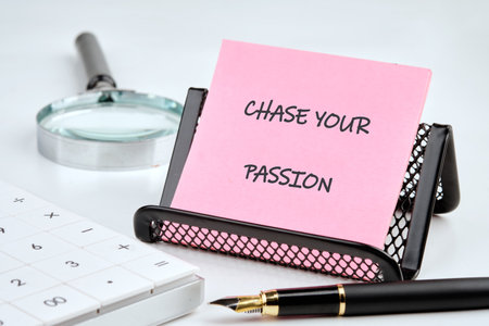Motivation Quote. CHASE YOUR PASSION words on a sticker on a stand in front of a white background.の写真素材