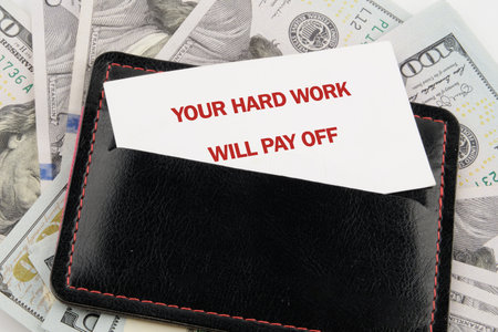 Concept of building success foundation. Text YOUR HARD WORK WILL PAY OFF.