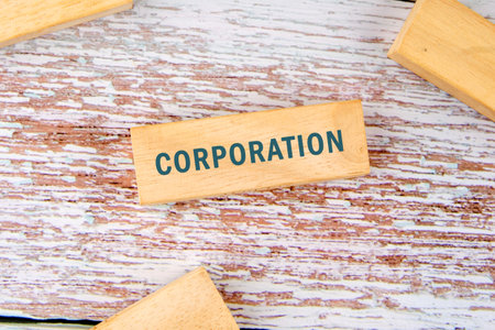 The concept word CORPORATION. Personal Income Tax, Corporate Tax, Financial Research, Documents, Reports and Calculations Concept.の写真素材