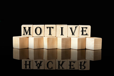 The concept word MOTIVE is assembled from wooden cubes. business motivational concept.の写真素材