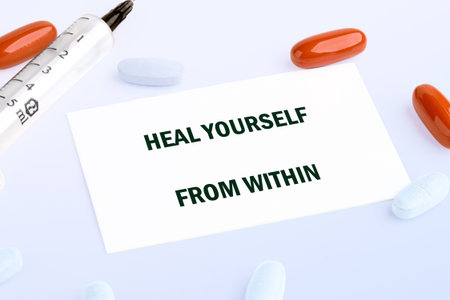 The concept phrase HEAL YOURSELF FROM WITHIN. Heal yourself, mental health, absent-minded, feeling concept.の写真素材