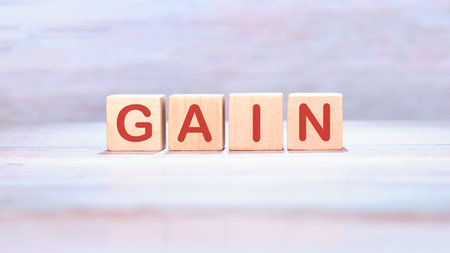 The concept word GAIN is assembled from cubes. Business and capital gains tax concept. Copy space.の写真素材