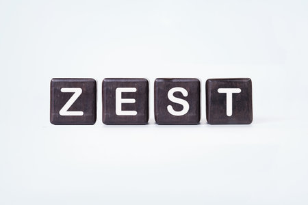 The concept word ZEST is assembled from wooden cubes. emphasizing motivation and creativity concept.の写真素材