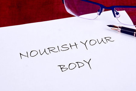 The concept phrase NOURISH YOUR BODY. The concept of beauty and health.の写真素材