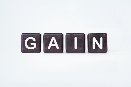 The concept word GAIN is assembled from cubes. Business and capital gains tax concept. Copy space.の写真素材