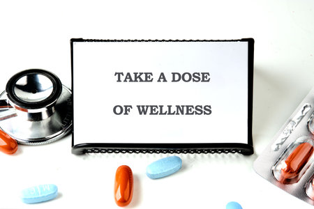 The concept phrase is TAKE A DOSE OF WELLNESS. Health concept. Pharmacological preparations,...