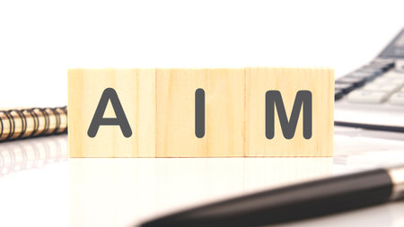 The AIM concept word is assembled from cubes. Business concept.の写真素材
