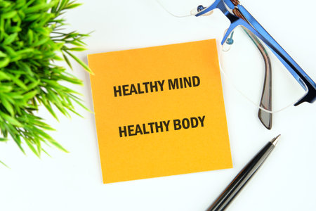The concept phrase is HEALTHY MIND HEALTHY BODY. The concept of beauty and health. Physical activity for body and mind relaxation, healthy lifestyle habits concept.の写真素材