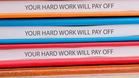 Concept of building success foundation. Text YOUR HARD WORK WILL PAY OFF.