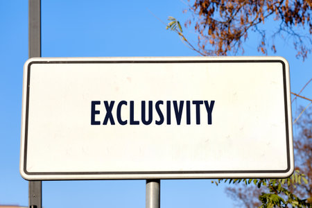 Equity, diversity, EXCLUSIVITY concept. Copy space. EXCLUSIVITY word written on a lonely road signの写真素材