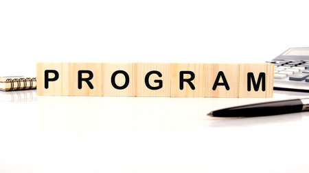 The concept word PROGRAM is collected of wooden cubes on a white background. Loyalty Program Shopping concept.の写真素材