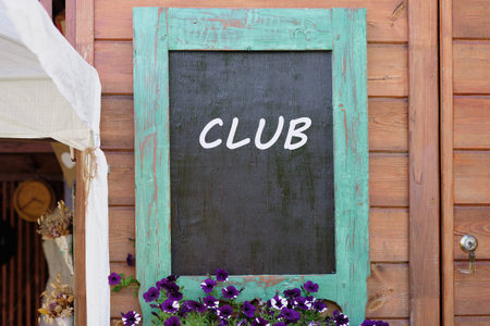 Business and Entrepreneurship. Copy space. Text Business Club written on Charming wooden wall with a...