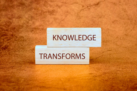KNOWLEDGE TRANSFORMS concept words on wooden blocks on a bright background.