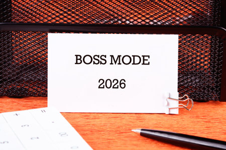 A card displaying the phrase 2026 is clipped on a mesh organizer, symbolizing determination and...