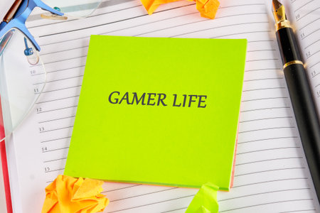 Bright green notes highlight the gamer lifestyle, surrounded by colorful crumpled paper and elegant stationery, capturing the essence of gaming passion and creativity in a cozy workspace.の写真素材