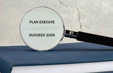 A magnifying glass enhances the text PLAN EXECUTE SUCCEED on a book, symbolizing the importance of...