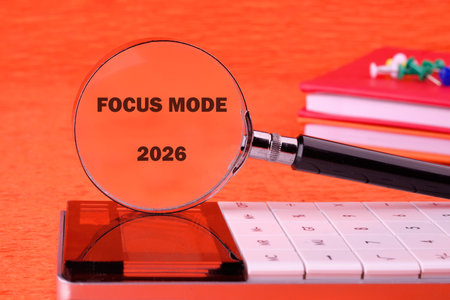 A colorful workspace featuring a magnifying glass over a calculator displaying focus mode for the...