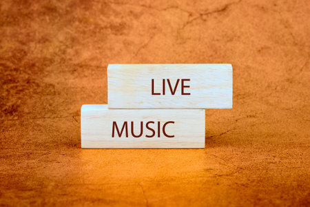 Wooden blocks displaying the words live music bring warmth and charm to any setting, inviting...