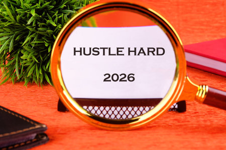 A magnifying glass focuses on a message about putting in hard work toward a successful future in...