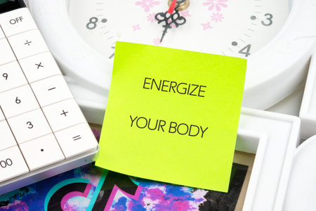 Bright green sticky note displays an inspiring message to energize your body, surrounded by a...