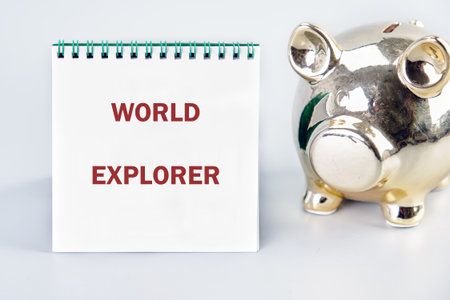 A cheerful piggy bank stands beside a notepad that declares world explorer. This scene inspires...