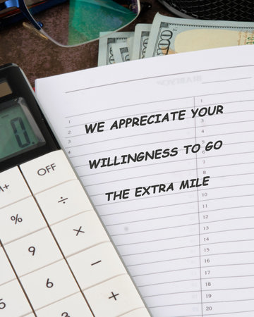 Close-up showing a calculator, money, and a document containing the text We appreciate your...
