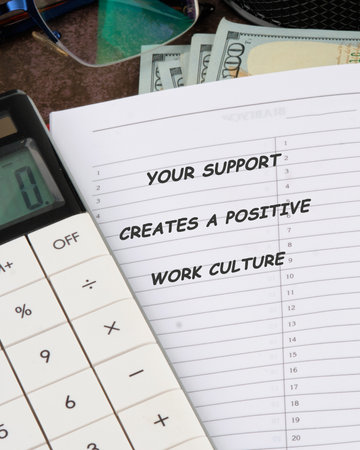 Close-up shows currency overflowing from an open notebook with the phrase YOUR SUPPORT CREATES A...