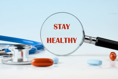 A magnifying glass sharply reveals the powerful message Stay Healthy.