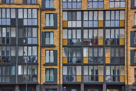 Windows of a modern residential building. Facade of a modern apartment building the New Borovaya...
