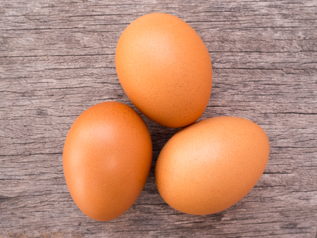 Three eggs on wooden rusticの写真素材