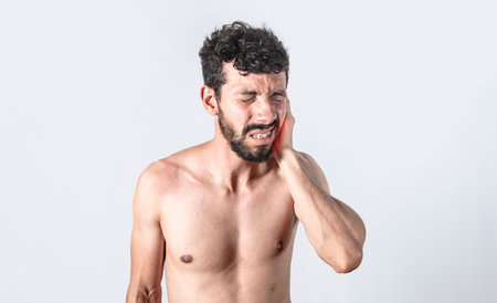 Person with earache on isolated background, man with earache on isolated background, ear disease...