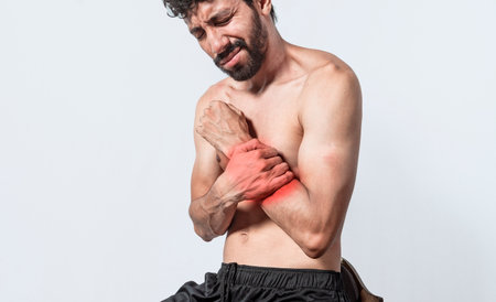 Person with wrist pain isolated, concept of man with pain in the hands, man with arthritis rubbing, person with pain in the wrist, Concept of arthritis in the wristの写真素材