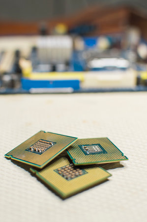isolated computer microprocessors, three computer processors with one computer motherboard, computer processor conceptの写真素材