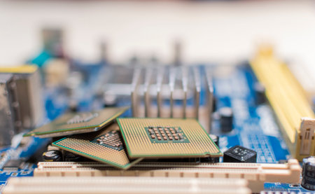 Close up of a motherboard, details of a computer motherboard, detail of a motherboard socket, three processors on a computer motherboardの写真素材