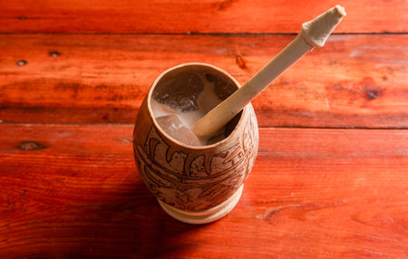 Nicaraguan cocoa drink in artisan jÃ­cara. Nicaraguan cocoa drink served in a traditional gourd....