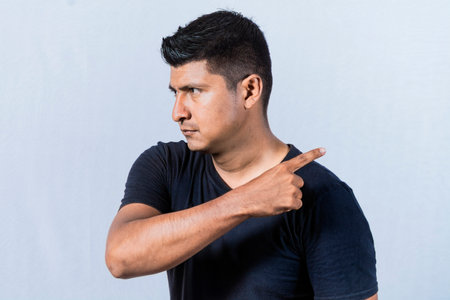 Angry person pointing to get out, Get out, angry bearded man looking to the side and pointing finger, angry man pointing to get outの写真素材