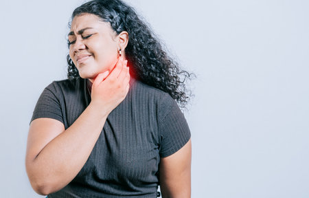 Young woman suffering with neck pain. Neck pain and stress concept. People with neck tension, Girl...