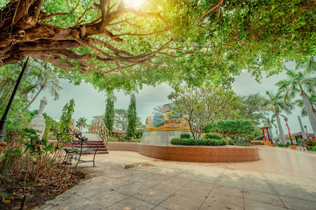 Traditional park of Nagarote, Nicaragua. A relaxed park with a wooden bridge over a water fountain, Beautiful Nagarote central park on sunny dayの写真素材