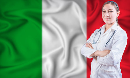 Female doctor on Italy flag. Doctor with crossed arms on Italy flag. Italy Health and Care conceptの写真素材