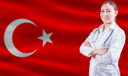 Female doctor on Turkey flag. Doctor with crossed arms on Turkey flag. Turkey Health and Care conceptの写真素材
